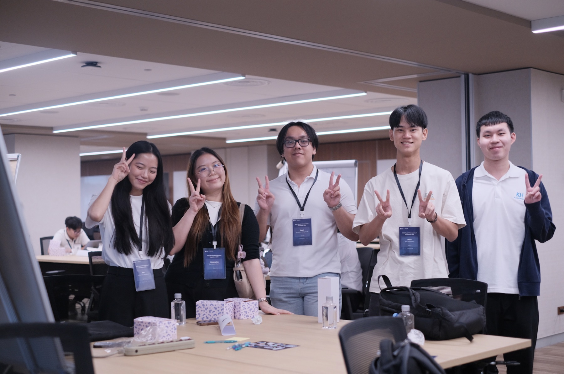 A hackathon team poses together during the working session