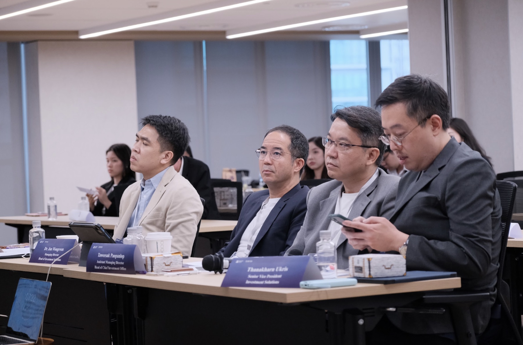 Judges listen to a hackathon presentation